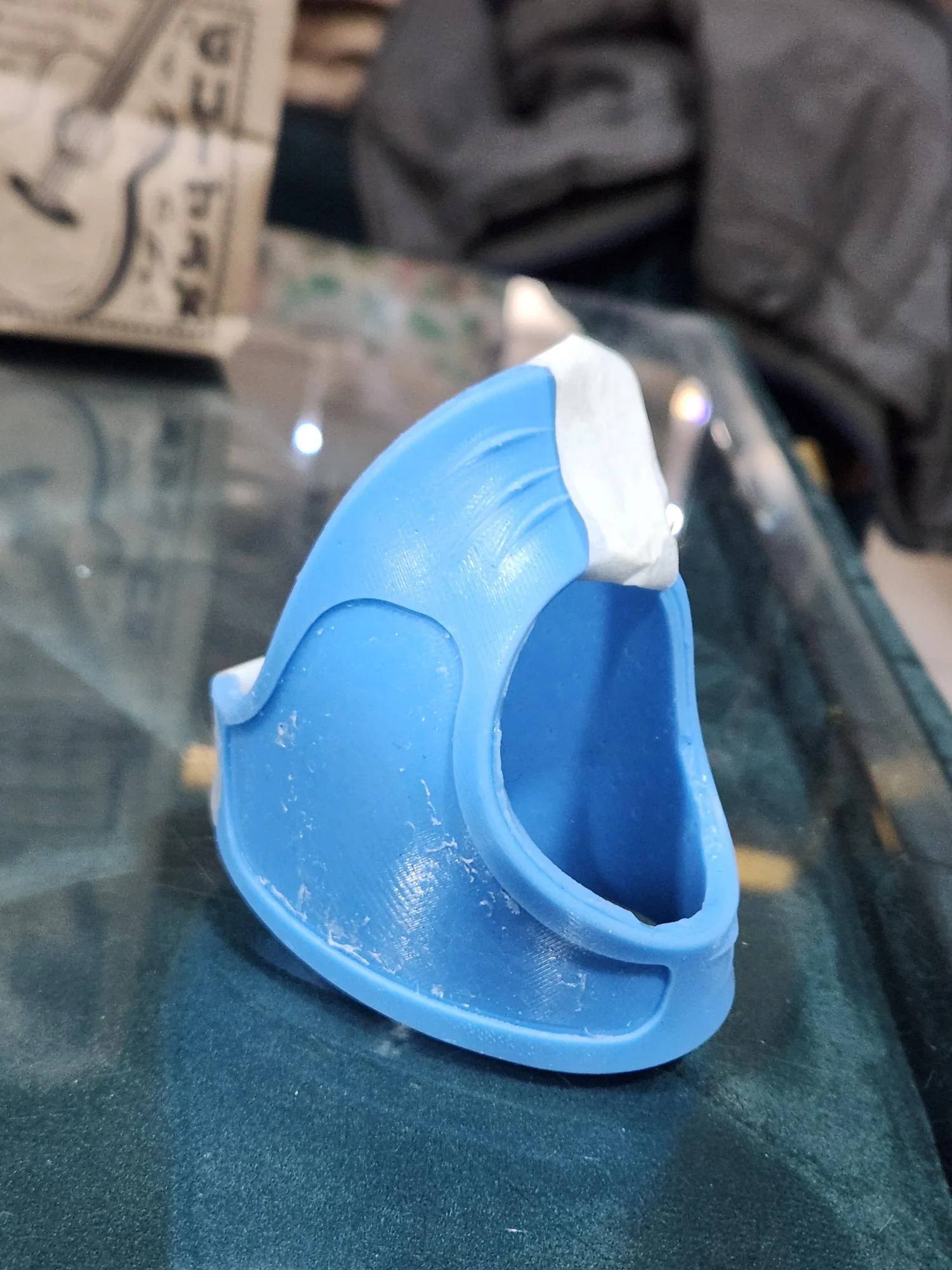 Blue wrapped prototype showing the hand opening and inner structure