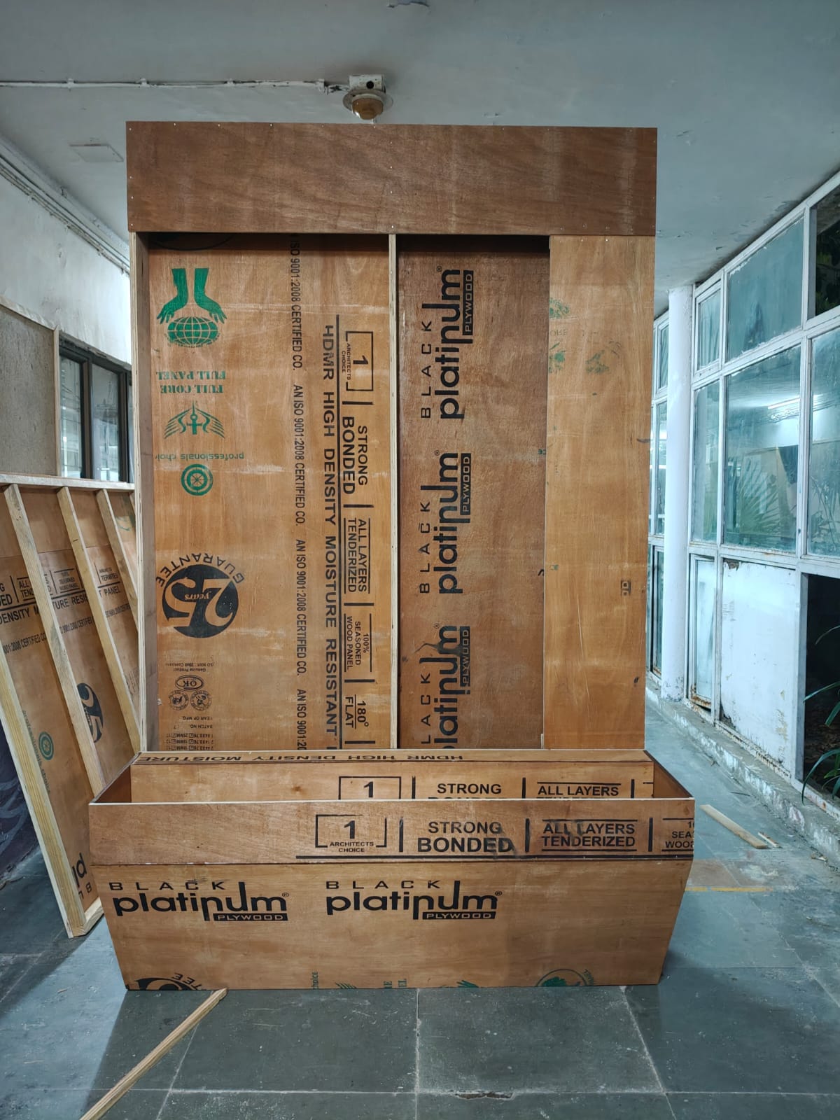 Plywood backing and base structure for Reflected Connections under construction